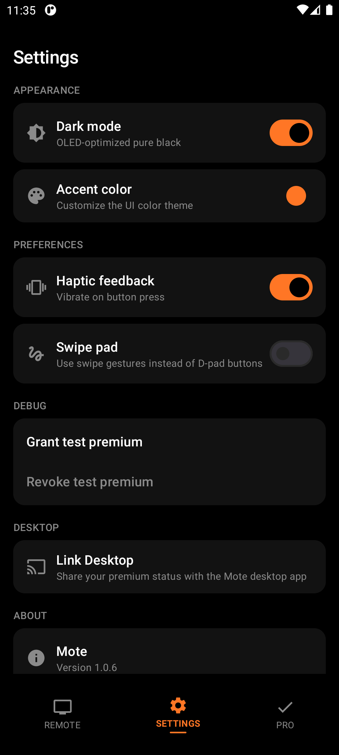 Settings screen in dark mode with a custom orange accent color, showing haptics and swipe pad options